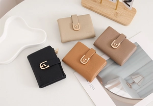 Detail of four multi-color PU leather folding wallets with tulip metal buckle and zippers