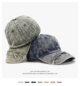Detail of distressed brim and stone washed fabric on a vintage style baseball cap
