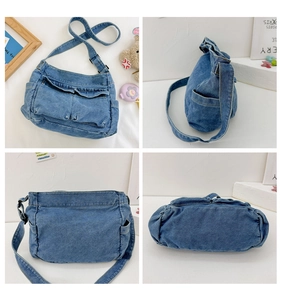 Detail view of denim crossbody bag showing front, side and back multi-pocket structure