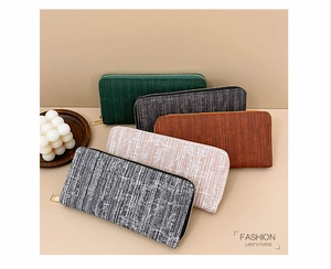 Detailed display of striped vintage long wallets in five colors with gold zippers