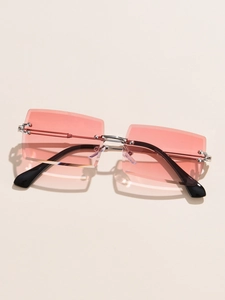 Detail view of pink gradient rimless rectangular lenses and silver metal frame sunglasses