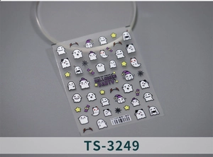 Detailed view of Halloween nail art stickers with white ghosts and candy icons
