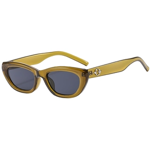 Retro cat-eye sunglasses with translucent olive green frames and silver metal accents