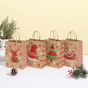 Set of four Christmas kraft paper gift bags with handles featuring Merry Christmas designs