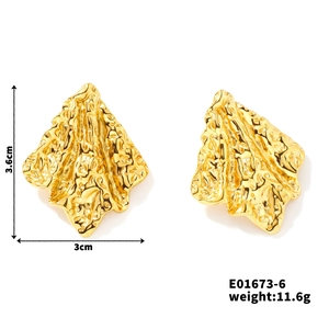 Detail view of gold geometric irregular lava texture earrings with size measurements