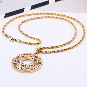 Detailed view of hollow hexagram pendant with sparkling white diamonds in gold finish