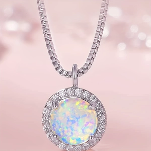 Close-up of 8mm opal pendant with halo diamonds on a silver adjustable box chain necklace