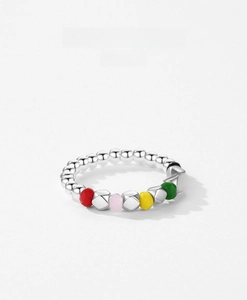 Macro detail of S925 silver beaded ring with vibrant colorful faceted resin beads