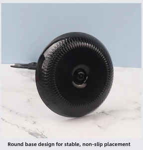 Detailed macro view of the weighted black metal disk base with anti-slip texture