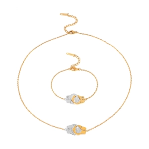 Polished stainless steel handcuff necklace and bracelet set with sparkly crystals