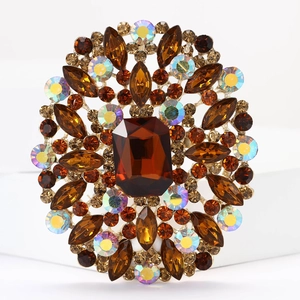 Macro shot of large amber crystal brooch with marquise stones in floral setting