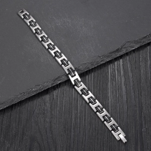 Brushed stainless steel bracelet for men with vintage black silicone strap detail