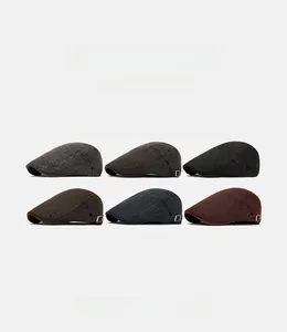Detail showing vintage newsboy caps in six colors with adjustable metal buckles