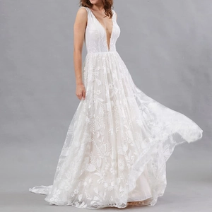 Elegant white deep V-neck bridal gown with floral lace embroidery and A-line tulle skirt