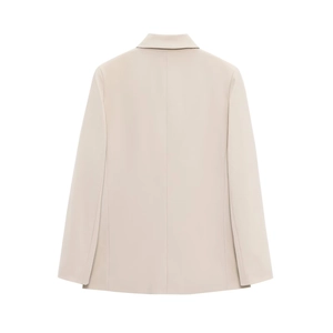Vue arrière d'un blazer croisé beige montrant le tissu tissé et les lignes d'épaules