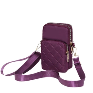 Purple quilted nylon crossbody bag with three zipper pockets and gold hardware