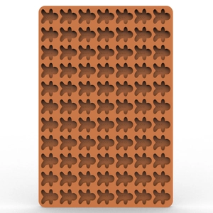 Detailed macro view of brown silicone mold with gingerbread man shapes for baking
