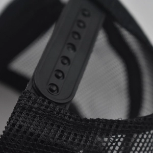 Detail of black snapback closure and mesh material on the baseball cap for adjustable fit