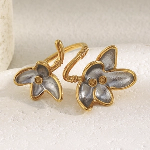 Macro view of dual-color flower open ring with gold and silver matte petal texture
