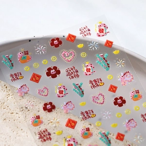 Chinese New Year embossed nail stickers with gold lucky charms and red festive patterns