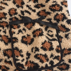 Oversized leopard print fleece jacket with black satin bow and contrast piping details