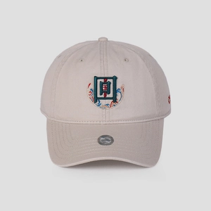 Macro shot of traditional Chinese embroidery and silver holographic seal on baseball cap
