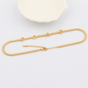 Detailed view of the 18K gold plated tennis chain necklace featuring LOVE letter pendants
