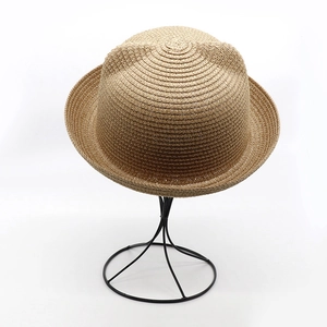 Khaki woven straw hat with cute cat ear design for kids and women on display stand
