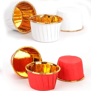 Detail of red and white greaseproof muffin liners with gold foil interior lining