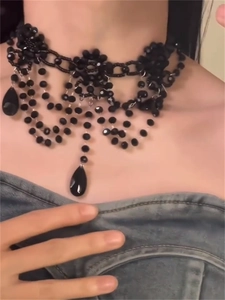 Detail of gothic black beaded flower choker with layered water drop pendants for women