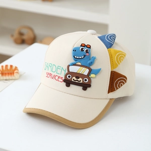 Detail of cartoon dinosaur embroidery and side fin decorations on kid's baseball cap