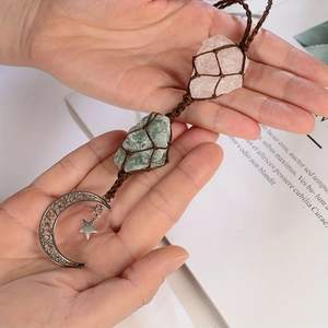 Handmade woven natural raw crystal pendant featuring rose quartz and moon star metal charms
