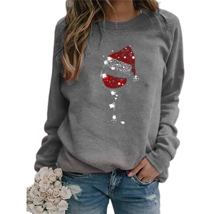 Detail of Christmas wine glass print with sequins on a long sleeve grey crewneck shirt