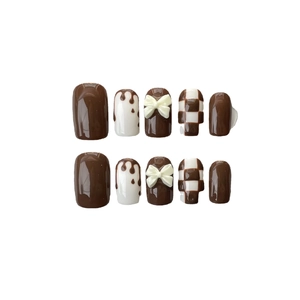 Brown and white checkerboard press-on nails with 3D bows and heart drip design