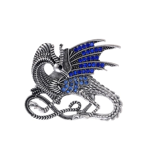Detailed mythical flying dragon brooch in vintage silver with blue rhinestone inlay