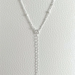 Detailed close-up of 925 sterling silver necklace spring clasp and adjustable extender chain