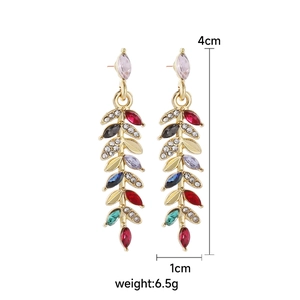Detailed size view of leaf-shaped earrings with colorful rhinestones on gold frame