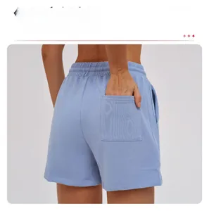 Close-up of light blue athletic shorts back pocket and elastic high waistband detail