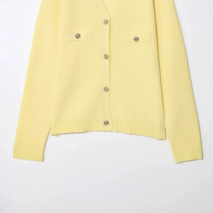 Women's yellow knit cardigan with V-neck design and five embossed gold buttons