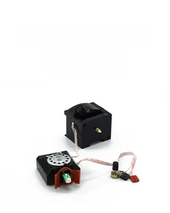 Macro detail of the internal mechanical cuckoo clock movement with bird speaker module