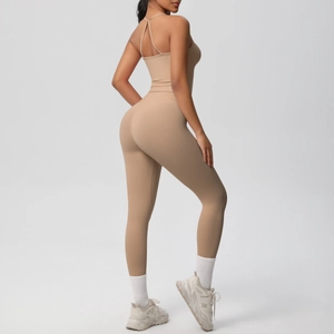 Detail of cross-back straps on skin-friendly nude-feel yoga set in khaki color