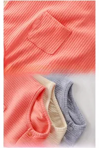 Detail of ribbed cotton baby bodysuit featuring a small pocket and soft resin snaps