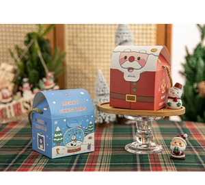 Christmas gift boxes featuring Santa and Snowman designs with golden braided handles