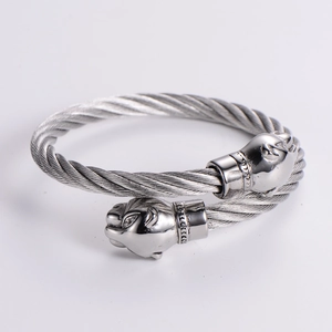 Adjustable stainless steel twisted cable bracelet featuring detailed leopard head ends