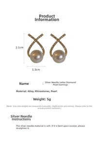 Detailed view of silver needle letter earrings with crystals, pearls and 2.1cm dimensions