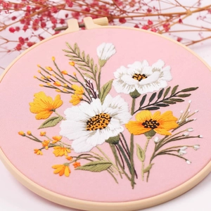 DIY hand embroidery kit with floral daisy pattern and 20cm wooden hoop on pink fabric