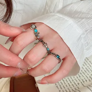 Vintage gold resin open rings set with turquoise and blue gemstones in retro style