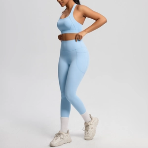 Close-up of sky blue high-waist yoga leggings with a practical side phone pocket