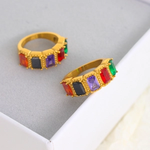 Macro detail of gold stainless steel rings with colorful zircon baguette stones