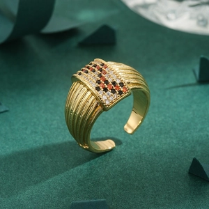 French grosgrain style adjustable gold ring with square black and orange cubic zirconia
